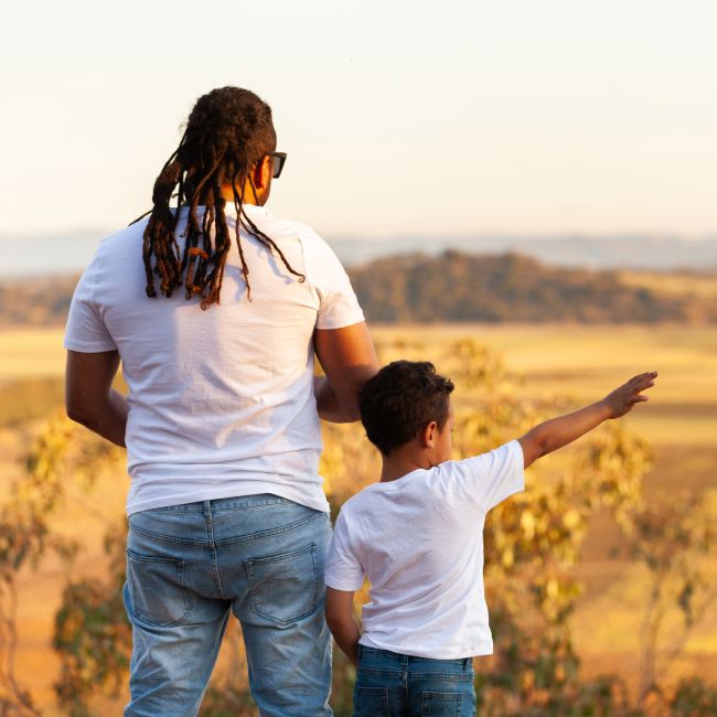 Father and son looking out to a view